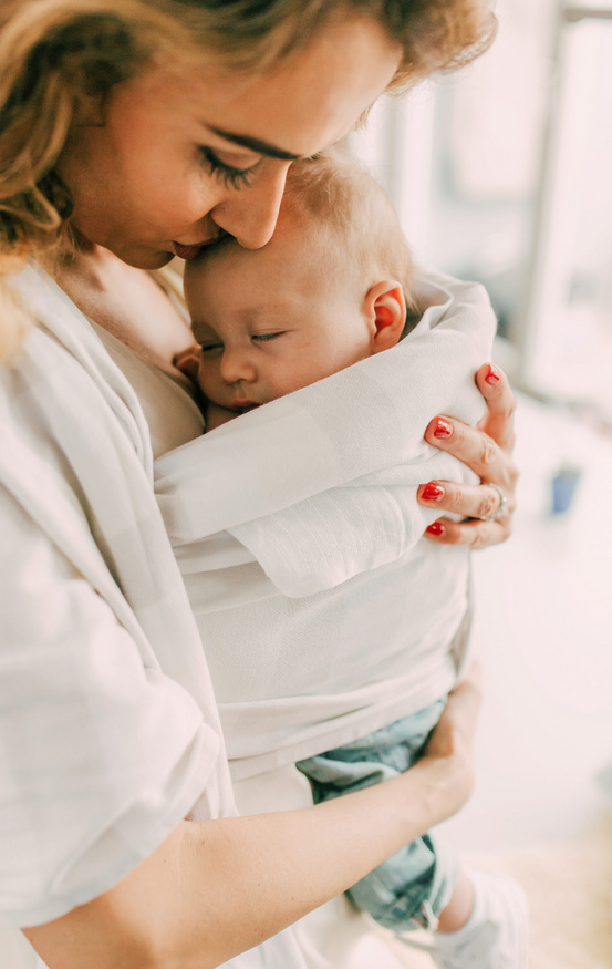 mom holding her baby close 